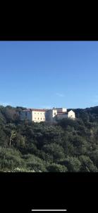 a group of white buildings on top of a hill at Domaine du Couvent de Saint Julien in Bonifacio