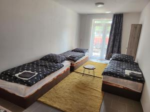 Кровать или кровати в номере Penzion Grusbach