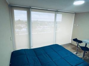 Ένα ή περισσότερα κρεβάτια σε δωμάτιο στο Departamento Home Studio