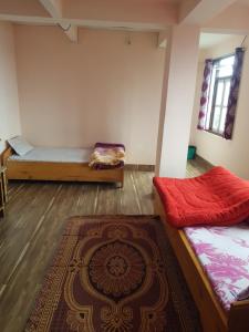 Hotel Rainbow Regency Ravangla South Sikkim客房内的一张或多张床位