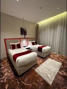 A bed or beds in a room at Jardin an