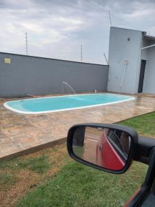 Bazén v ubytování WM Milão Piscina, Churrasqueira e Suíte Privativa nebo v jeho okolí