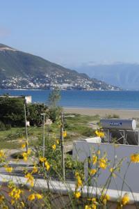 a view of a beach and a body of water at Osmenaj Studios in Vlorë