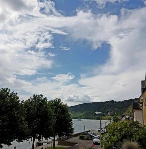 a view of a body of water with a cloudy sky at Haus Rheinglück "Liebenstein" in Kamp-Bornhofen