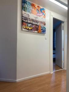 a painting hanging on a wall in a room at Billund zero stat in Brande