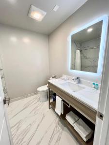a bathroom with a sink and a mirror at Nob Hill Motor Inn -Newly Updated Rooms! in San Francisco