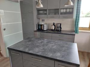 Kuchyňa alebo kuchynka v ubytovaní Wohnung mit Charme in Pinsdorf
