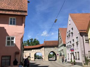 a group of buildings on a street in a town at Casita am Baldinger Tor in Nördlingen +5 photos