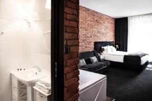 Posteľ alebo postele v izbe v ubytovaní Hotel Betmanowska Main Square Residence Adults Only
