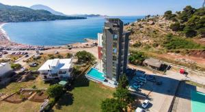 an aerial view of a building next to a body of water at Hostel Marina in Sutomore
