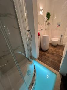 a bathroom with a shower and a toilet at Al centro exclusive apartment in Brindisi +33 photos