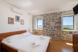 Posteľ alebo postele v izbe v ubytovaní Jasminka apartments