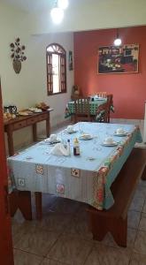a table with a blue and white table cloth at Pousada Caminho da Serra in Tiradentes