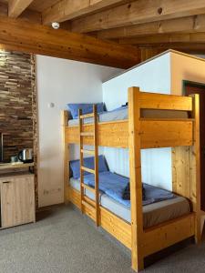 a bunk bed room with two bunk beds in a cabin at Touristenheim Bergfreude in Leukerbad