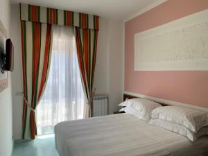 Postel nebo postele na pokoji v ubytování Hotel Conte