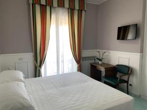 Postel nebo postele na pokoji v ubytování Hotel Conte