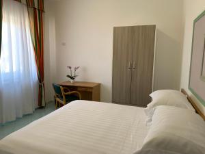 Postel nebo postele na pokoji v ubytování Hotel Conte