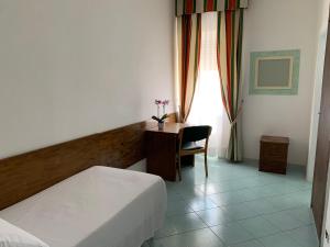 Postel nebo postele na pokoji v ubytování Hotel Conte