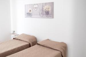Postel nebo postele na pokoji v ubytování Zangara Flat