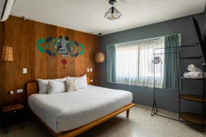 Postel nebo postele na pokoji v ubytování Nílu Cancun Downtown by Selina