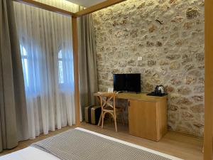 TV o dispositivi per l'intrattenimento presso Valta Hotel