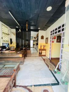 a living room with a blue ceiling and a table at Best Home Stay in Nagla Dhīmar