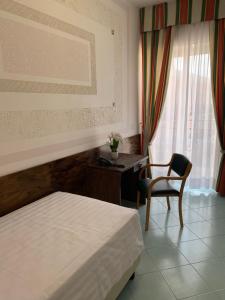 Postel nebo postele na pokoji v ubytování Hotel Conte