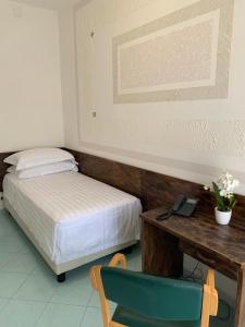 Postel nebo postele na pokoji v ubytování Hotel Conte