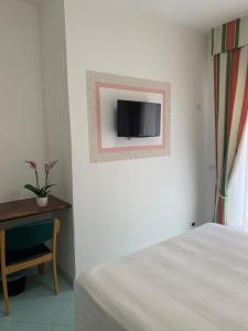 TV a/nebo společenská místnost v ubytování Hotel Conte