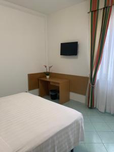 TV a/nebo společenská místnost v ubytování Hotel Conte