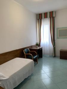 Postel nebo postele na pokoji v ubytování Hotel Conte