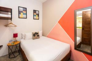 Postel nebo postele na pokoji v ubytování Nílu Cancun Downtown by Selina