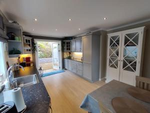 a kitchen with a sink and a counter top at Nearby Bergen, Midtunlia 27d in Bergen
