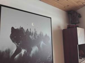 a large picture of a wolf on a wall at The Wolfs Den in Bancroft