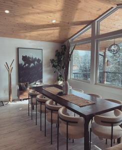 a dining room with a table and chairs at The Wolfs Den in Bancroft
