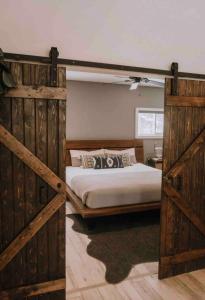 a bedroom with two sets of wooden double beds at The Wolfs Den in Bancroft