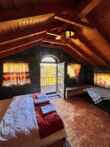 a bedroom with a large bed and a window at AXÂRA VİLLA SUİT in Pazar