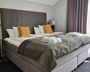 Postel nebo postele na pokoji v ubytování Hotel Skansen + 37 fotografií