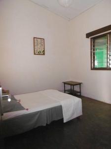 Ένα ή περισσότερα κρεβάτια σε δωμάτιο στο Villa face à la mer - calme et détente