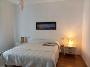 Postel nebo postele na pokoji v ubytování Asfodelo Home