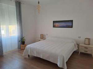 Postel nebo postele na pokoji v ubytování Asfodelo Home
