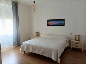Postel nebo postele na pokoji v ubytování Asfodelo Home