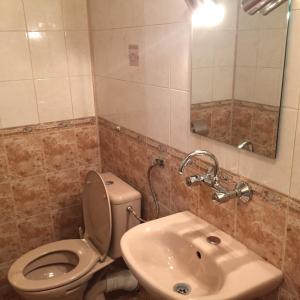a bathroom with a toilet and a sink at Bora Apartment in Sandanski