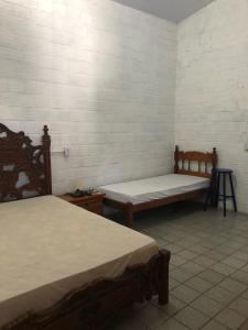 Кровать или кровати в номере Paraíso na Barra