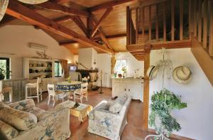 a living room with a couch and a table at Gîtes de La Palombière in Les Eyzies-de-Tayac