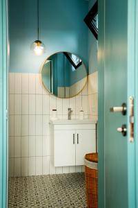 a bathroom with a sink and a mirror at Villa Capri-Kaprovani in Shekvetili +29 photos