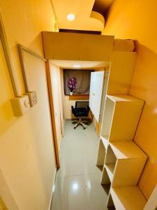 an overhead view of an office with a desk in a room at Couples Loft Partition CLOSE to MALL OF EMIRATES METRO in Dubai