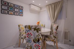 a dining room with a table and two chairs at EPA Apartment - Swedish style Souterrain in Rust