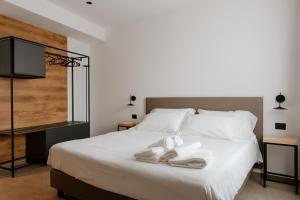 Postel nebo postele na pokoji v ubytování Belladonna Hotel