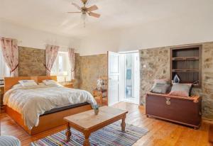 a bedroom with a large bed and a table at Villa Azul, Graça Portugal in Pedrógão Grande +71 photos